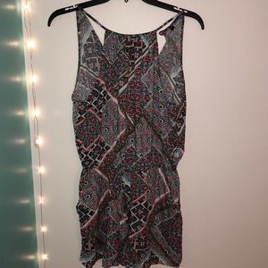 Fun floral romper with a tie in the front.